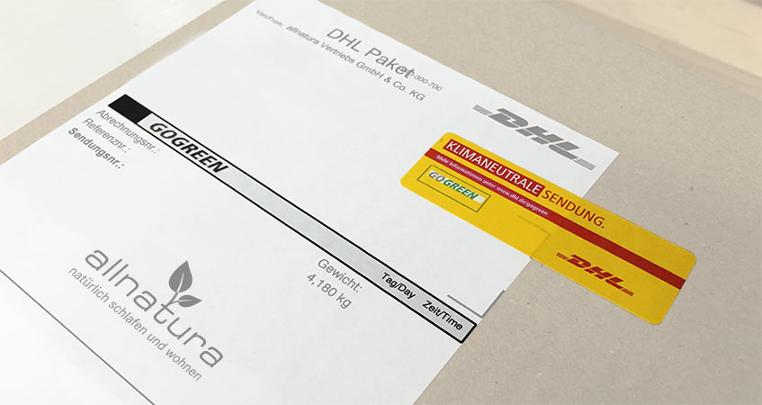 DHL GoGreen Aufkleber für ein klimaneutral versendetes Paket