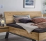 Modernes Massivholzbett Neras mit umgedrehter Holzkufe - hier mit Holzkopfteil Modernes Massivholzbett Neras mit umgedrehter Holzkufe, hier mit Holzkopfteil
