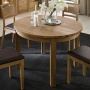 Tisch Corvo - runder Tisch in modernem Design, hier aus edlem Wildeichenholz